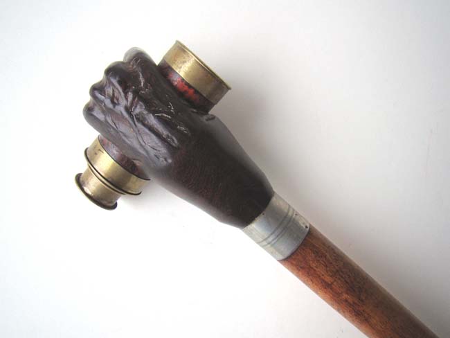 A 20th century Walking Stick featuring a carved 'clenched fist' knob holding a small telescope — image 3